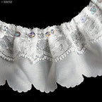 Full roll of 10 metres of white nylon lace trim displayed