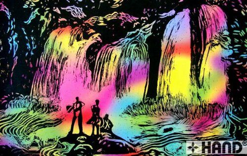 Artist using scratch art paper with a stylus tool