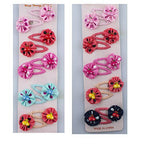 Close-up of a rosette hair clip barrette in pink.