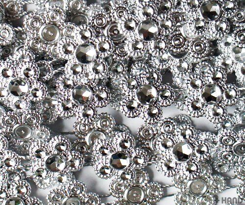 Close-up of the silver flowers trim showcasing intricate details.