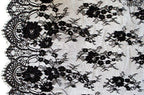 Close-up of NO.387 fine pattern wide corded lace in black