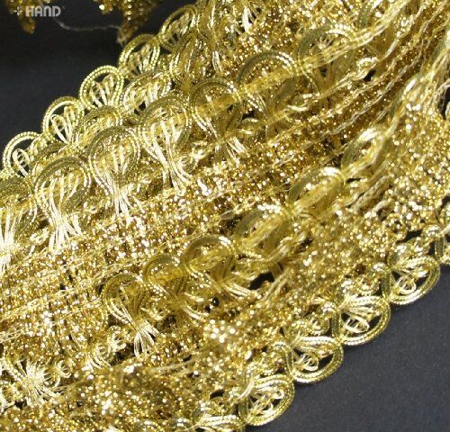 Close-up of the 40 mm wide gold metallic trim showing its texture.
