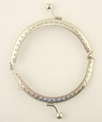 Side view of the 85 x 45 mm purse frame showcasing perforations.