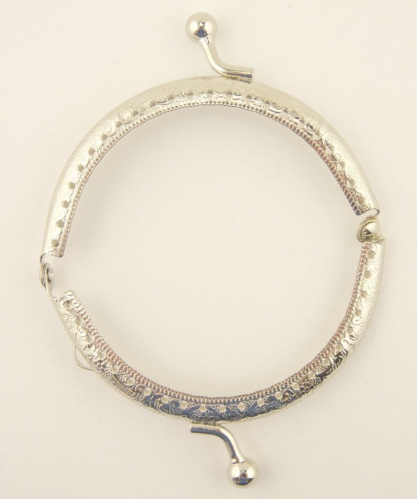 Side view of the 85 x 45 mm purse frame showcasing perforations.