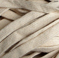 Flat cream cotton rope cord trim displayed on a white background.
