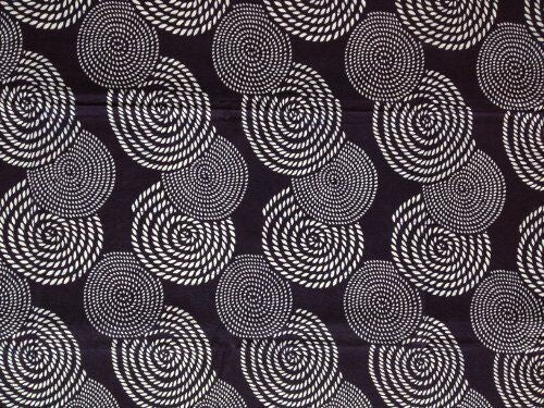 Close-up of printed blue cloth with circle pattern