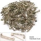 Safety lock brooch pins shown with a measuring tape for size reference