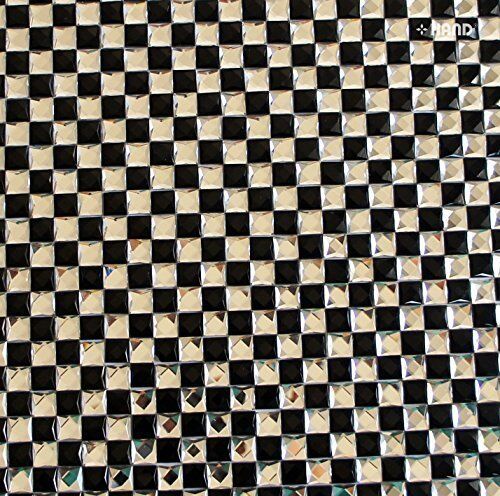 Close-up of decorative black and clear diamante gems on hot-fix sheet.