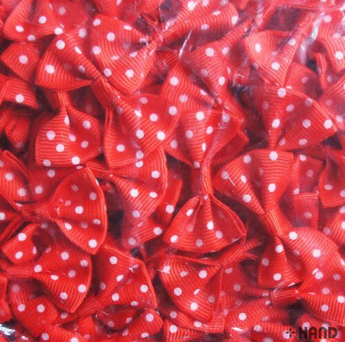 Close-up of red ribbon bow showcasing white dots detail