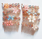 Assorted design of metal hair comb showcasing rhinestone details.