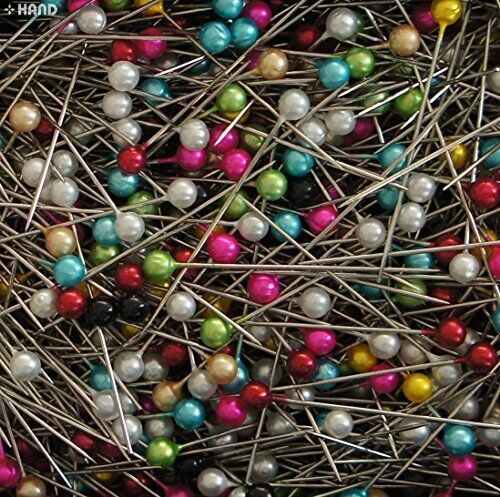 Long pearl pins arranged neatly in the box