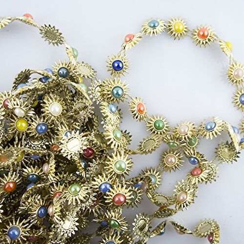 Gold tone garment trim with coloured enamel design.