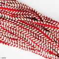 BRT10 Red with White Edges Cord Rope Trim displayed on a table.