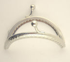 Close-up of the kiss clasp lock on the silver tone purse frame.