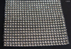 Close-up of gold diamante ribbon trim showcasing sparkle