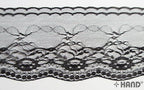 10 metres of black lace border trim rolled on a spool.