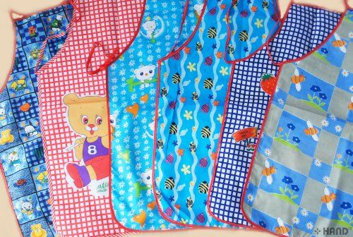 Close-up of a colourful kids' apron with a pocket