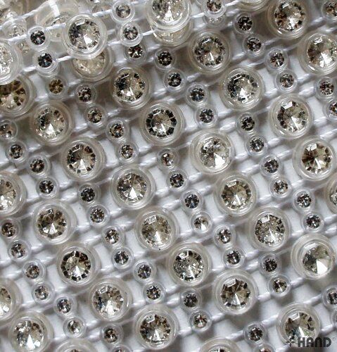 Rhinestones trim displayed on a crafting table with tools