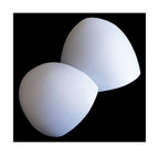 Two pairs of white thin bra pads on a flat surface.