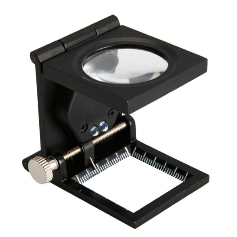 Fold-flat linen tester with LED light on a table