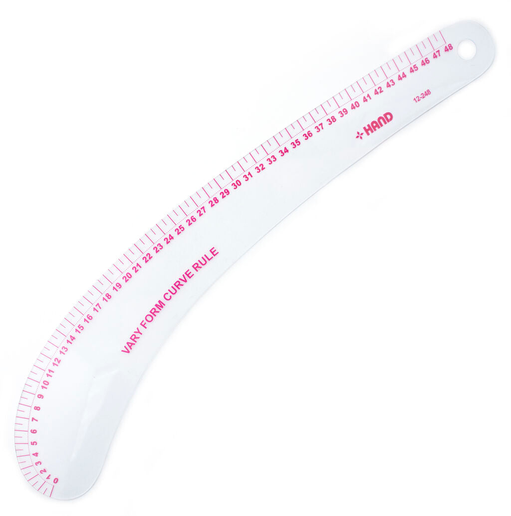 Flexible metric vary form curve ruler displayed on a table