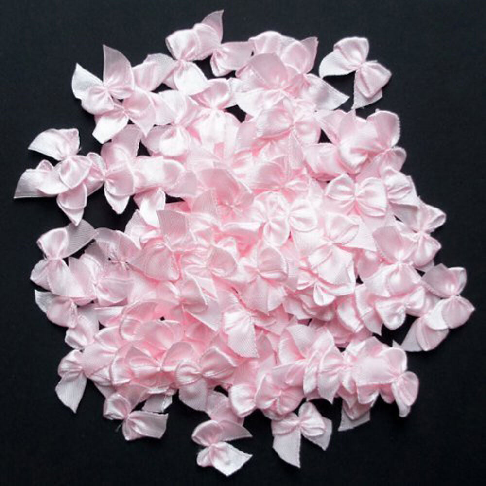 Pack of small decorative pink ribbon bow trims