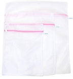 Zipped laundry bag in dense net fabric for delicate items