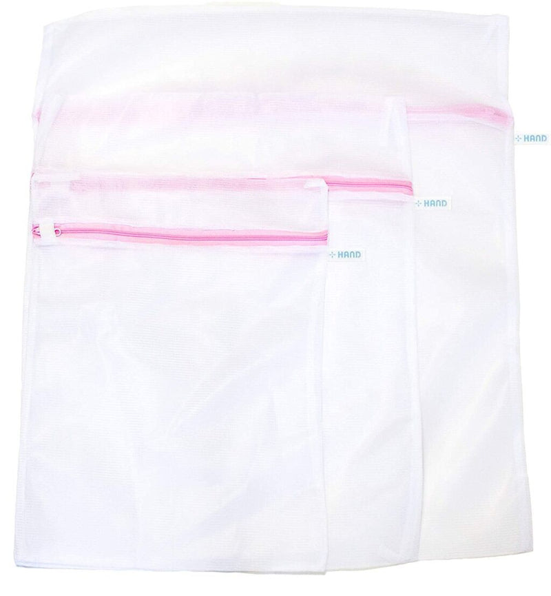 Zipped laundry bag in dense net fabric for delicate items