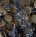 Close-up of vintage gold press stud button set