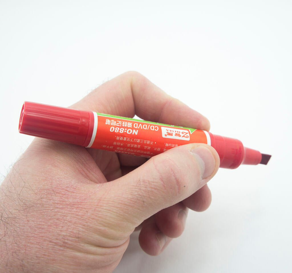 Pack of two red permanent markers on a white background