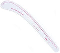 Flexible curve ruler laid flat on a crafting table