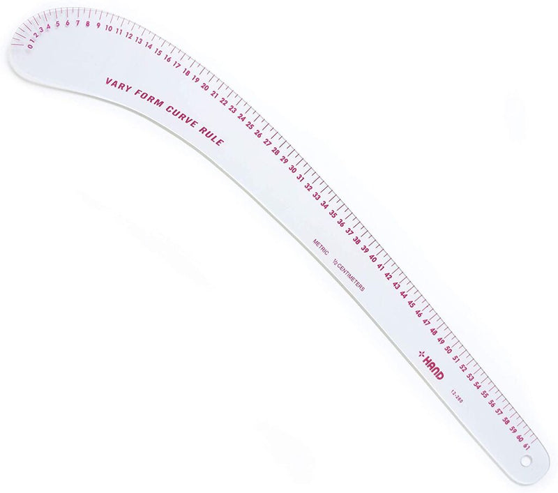 Flexible curve ruler laid flat on a crafting table