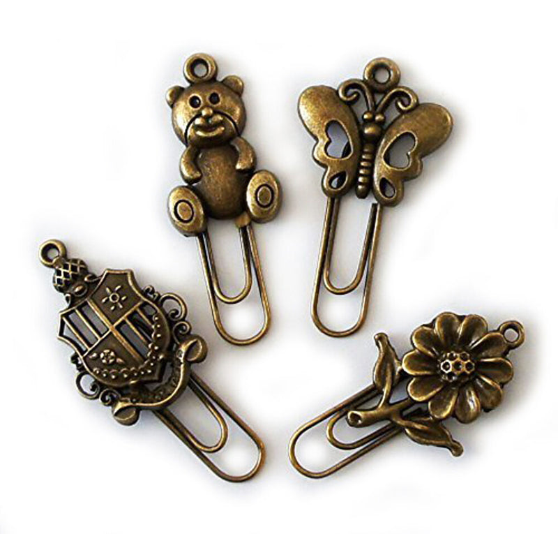 Four vintage gold metal bookmarks displayed together