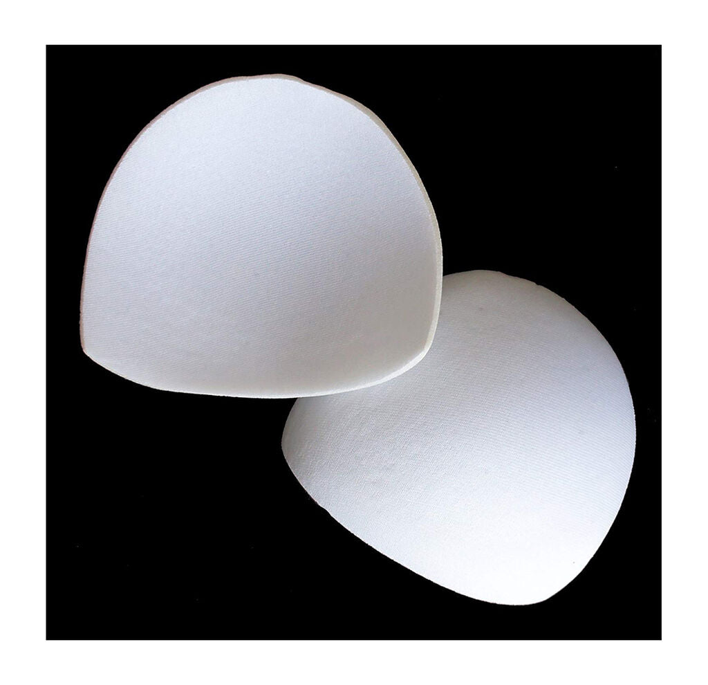 Two pairs of white comfortable bra pads displayed on a surface.