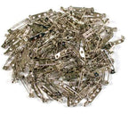 Close-up of 25mm safety lock brooch pins in a pack of 50