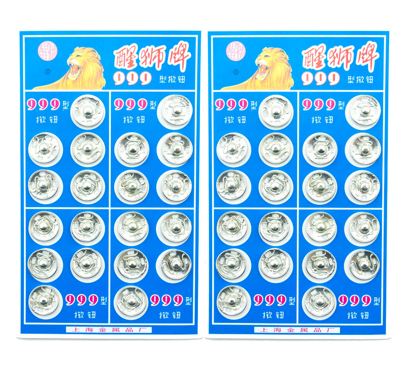 Close-up of silver metal clip buttons for sewing projects.