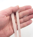 Close-up of extra strength max stretch flat elastic in skin colour.