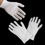 Close-up of lightweight gloves suitable for handling coins and jewellery.