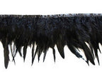 Close-up of black duck feather fringe trim on a white background.