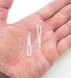 Close-up of a clear plastic alligator shirt clip