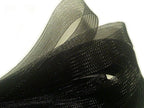 Black nylon crin trim displayed on a white background
