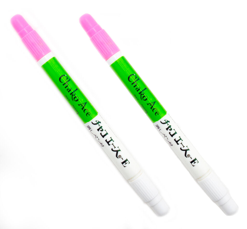 Two water soluble bright pink fabric marker pens with eraser tips.