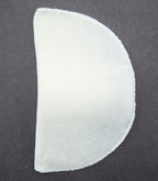 Children's shoulder pads arranged on a flat surface.