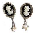 Two vintage elegant brooches adorned with clear crystals.