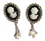 Two vintage elegant brooches adorned with clear crystals.