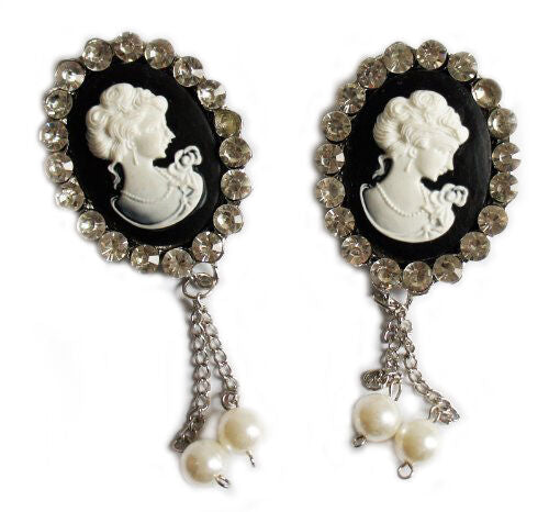 Two vintage elegant brooches adorned with clear crystals.