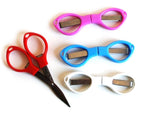 Two pieces of 4 inch folding safety scissors displayed