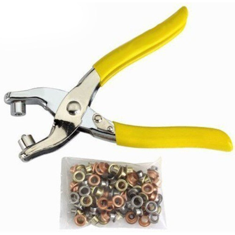 Professional eyelet grommet setting tool kit displayed on a table.