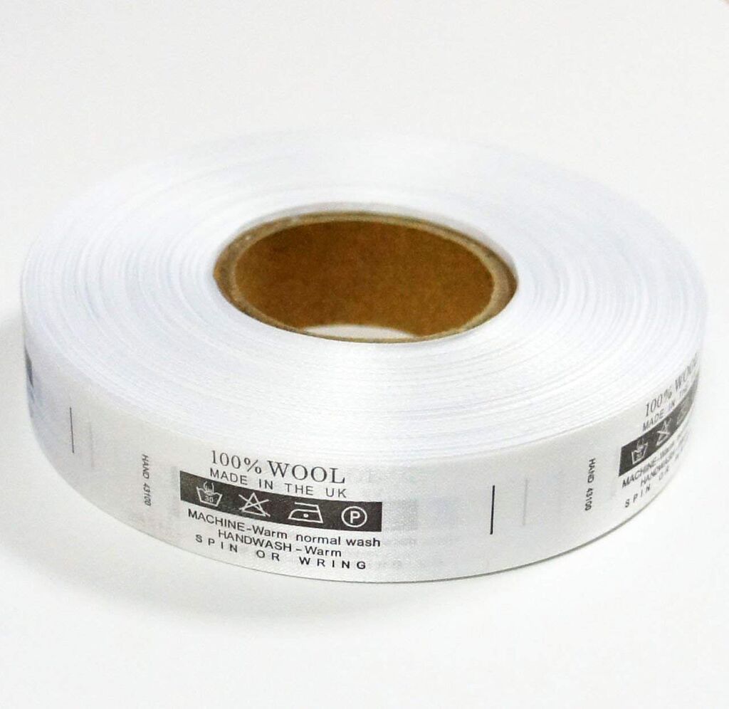 Close-up of wash care labels showing care instructions for wool.