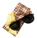Unisex polarised driving sunglasses with tinted lenses and metal frame.